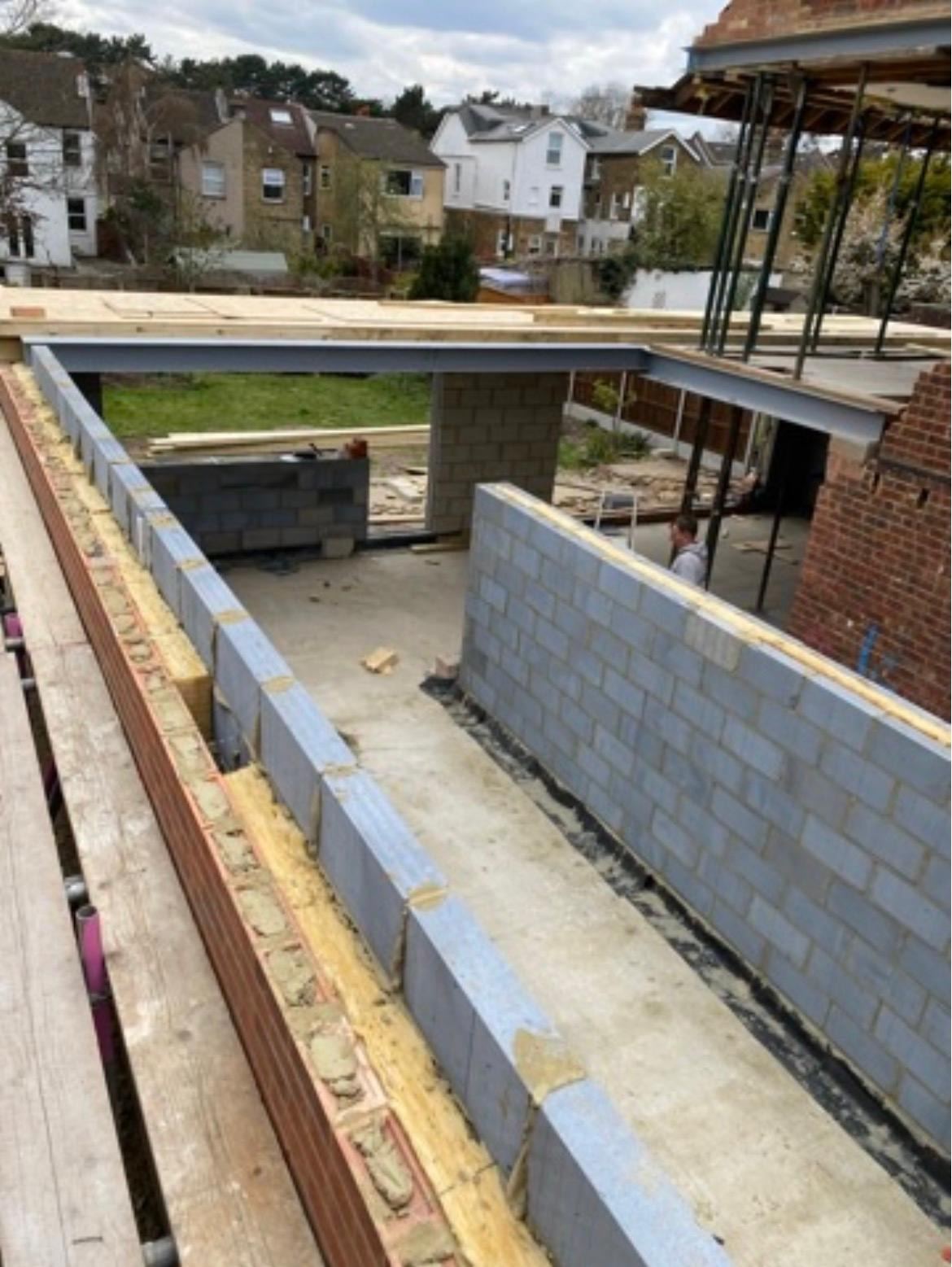 Steel beams and new blockwork walls installed during structural works on a rear extension