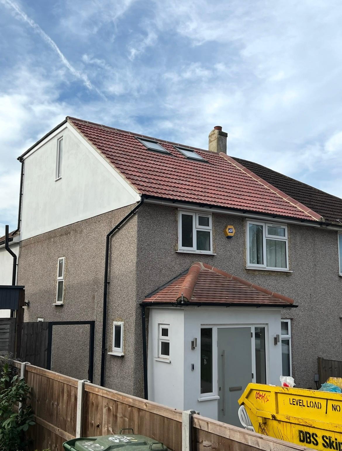 Loft conversion with rooflights and rendered gable to the front elevation