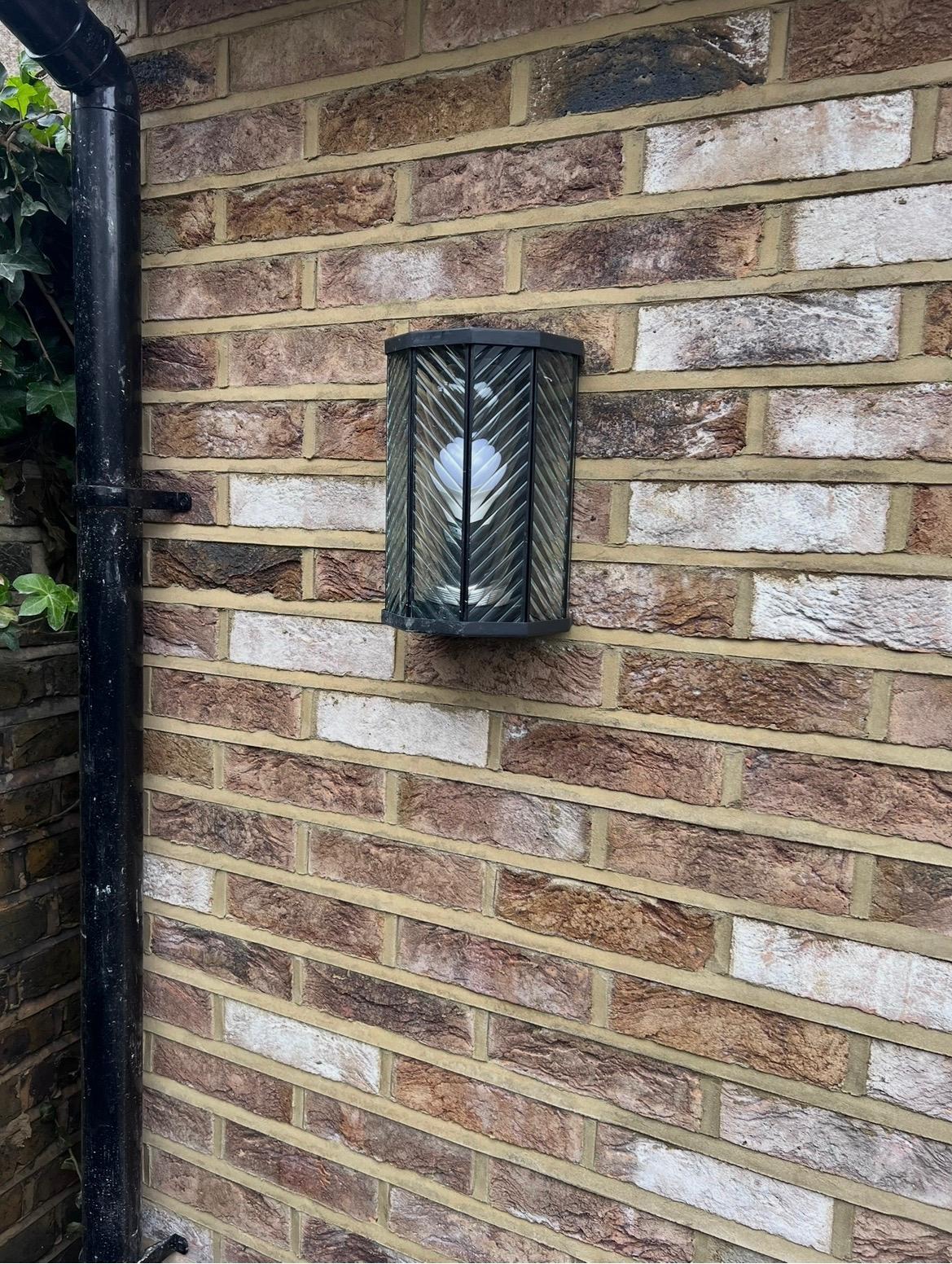 Exterior wall light and electrical installation detail on a completed Ashcroft project