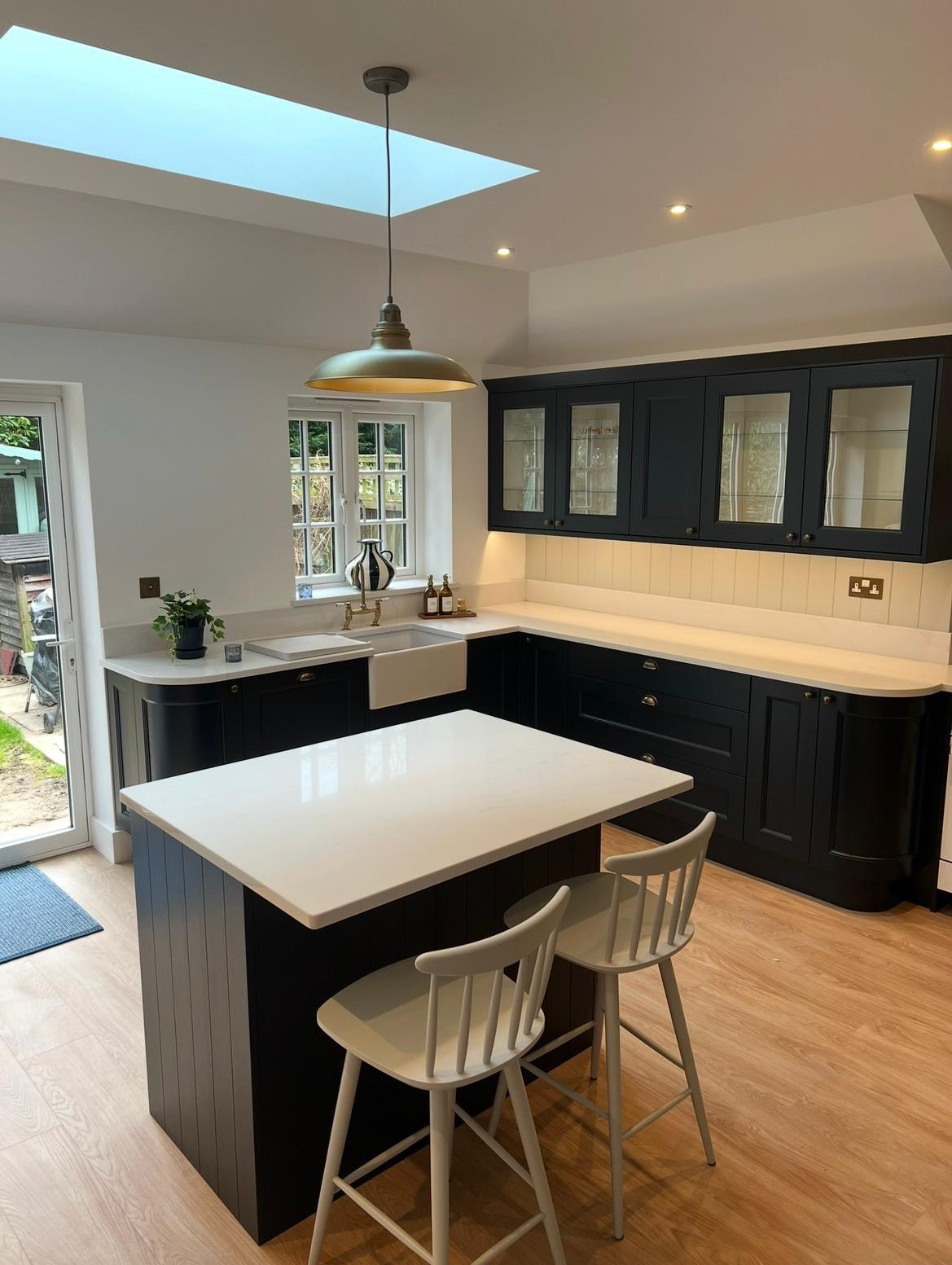 Kitchen extension with shaker cabinetry, Belfast sink and rooflight above the island