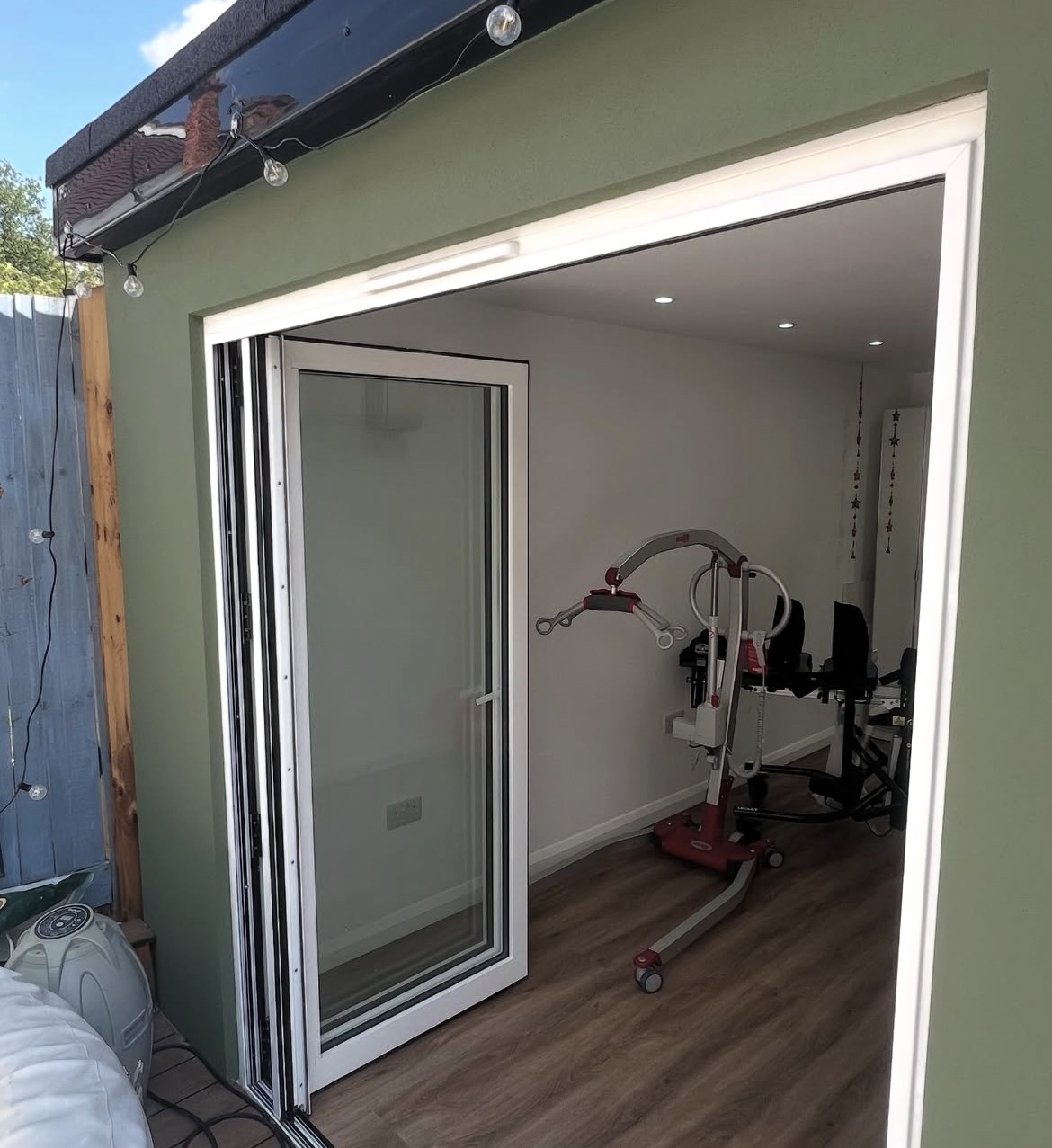 Open doorway of a completed garden outbuilding fitted out for year-round use