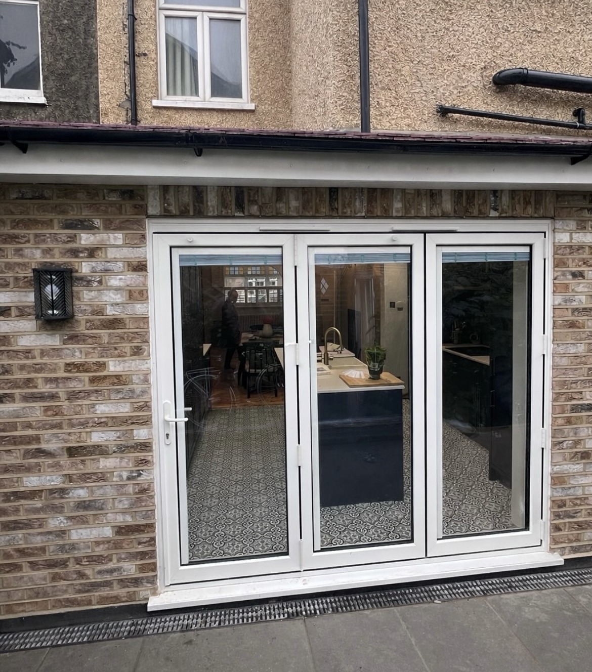 Renovated rear elevation with new garden doors and decorative brickwork